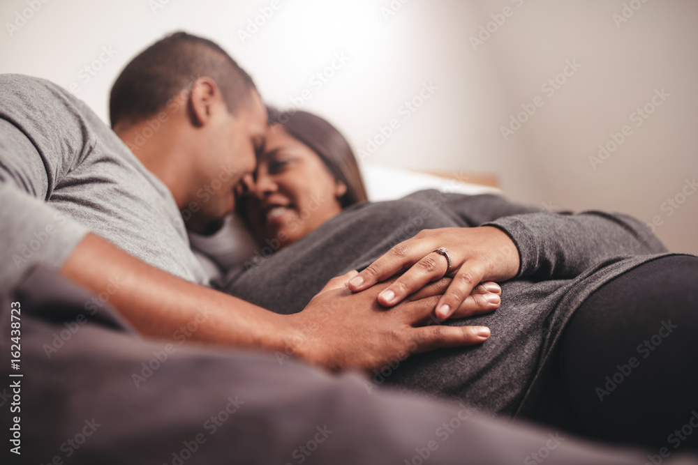 Romantic pregnant couple waiting for a child Romantic pregnant couple waiting for a child