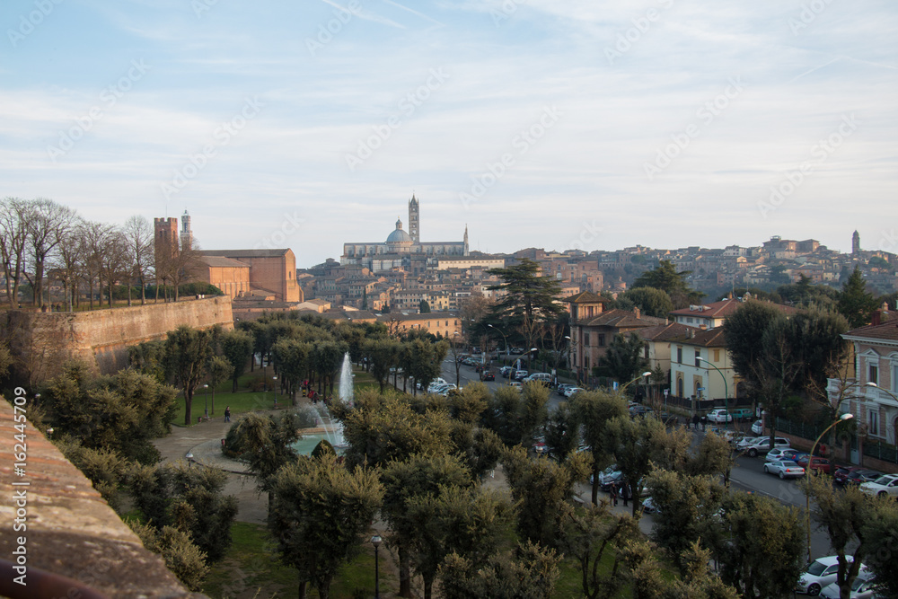 Public park and Duomo di Siena on background. Viem from Medici fortress. Tuscany. Italy.
