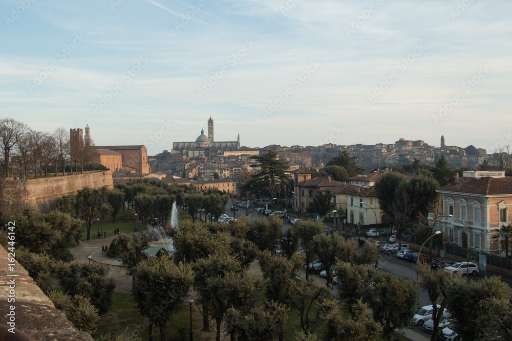 Public park and Duomo di Siena on background. Viem from Medici fortress. Tuscany. Italy.