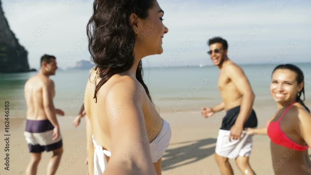 Girl Taking Selfie Of Cheerful People Running In Water On Beach, Happy Young Man And Woman Group Having Fun Slow Motion 120 Girl Taking Selfie Of Cheerful People Running In Water On Beach, Happy Young Man And Woman Group Having Fun Slow Motion 120