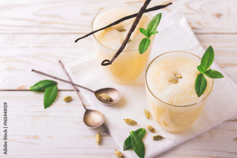 Traditional Indian mango lassi with cardamon, mint, vanilla and saffron Traditional Indian mango lassi with cardamon, mint, vanilla and saffron