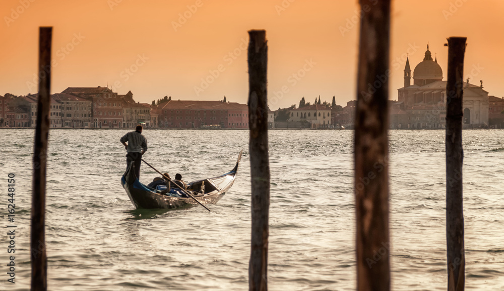Romantic couple on gondola in the Grand Canal, Venice, Italy