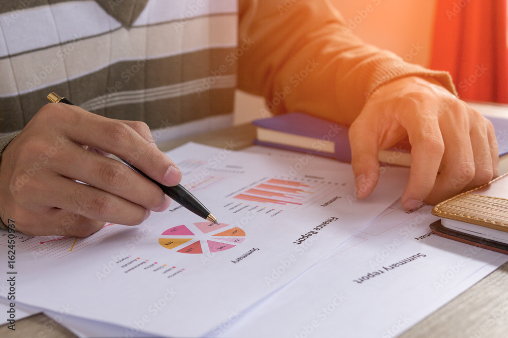 Businessman check profit document and calculate about and note data cost at home ,Finance managers task,Concept business and finance Businessman check profit document and calculate about and note data cost at home ,Finance managers task,Concept business and finance