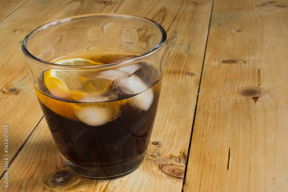 Cola with lemon and ice Cola with lemon and ice