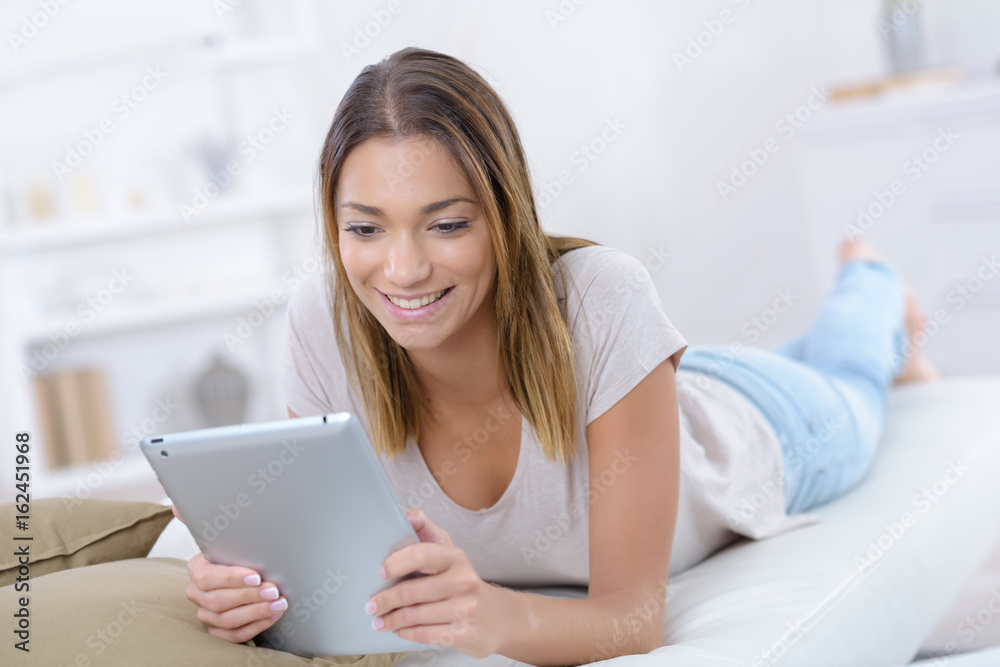 young woman using tablet browsing interne young woman using tablet browsing interne