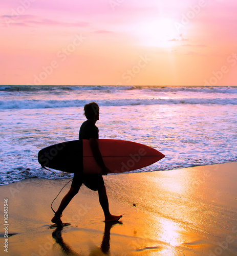 Surfer at the beach, Bali