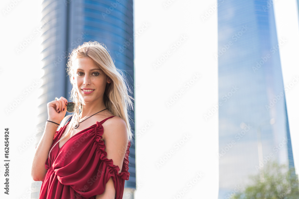 Fototapeta premium happy beautiful blonde woman smiling looking at the camera and posing