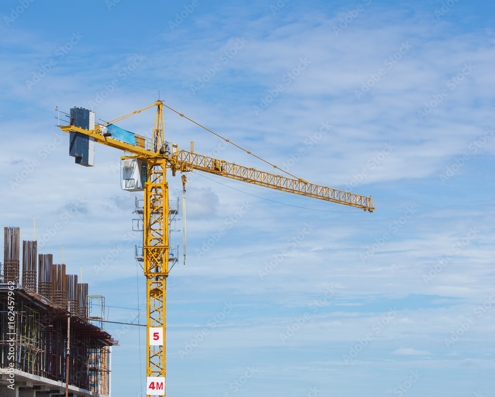 construction crane of building industry with blue sky background