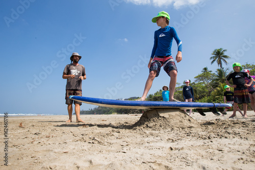 Kids learn the basics at a surf school in Santa Teresa, Costa Rica