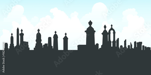 Silhouette of a graveyard crowded full of tombstones.