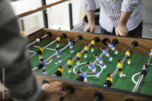 People Playing Enjoying Foosball Table Soccer Game Recreation Leisure