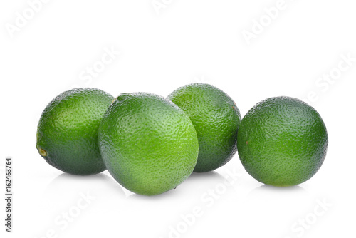 four fresh green lime isolated on white background