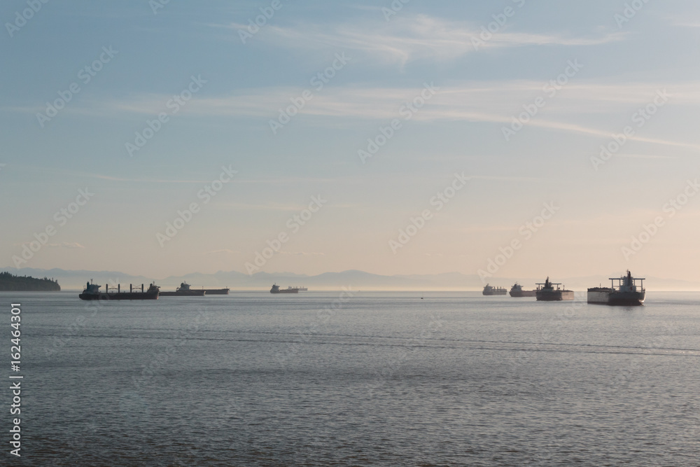 Photo of distant ships and mountain on the horizon