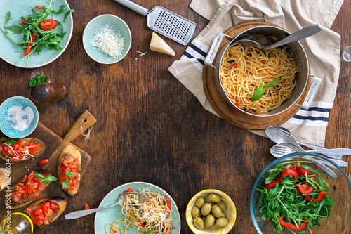 Frame of Italian pasta and snacks on a wooden table