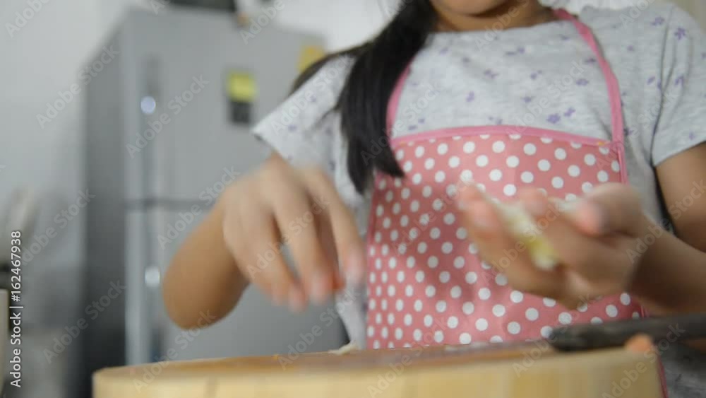 Hands chopping onion in kitchen