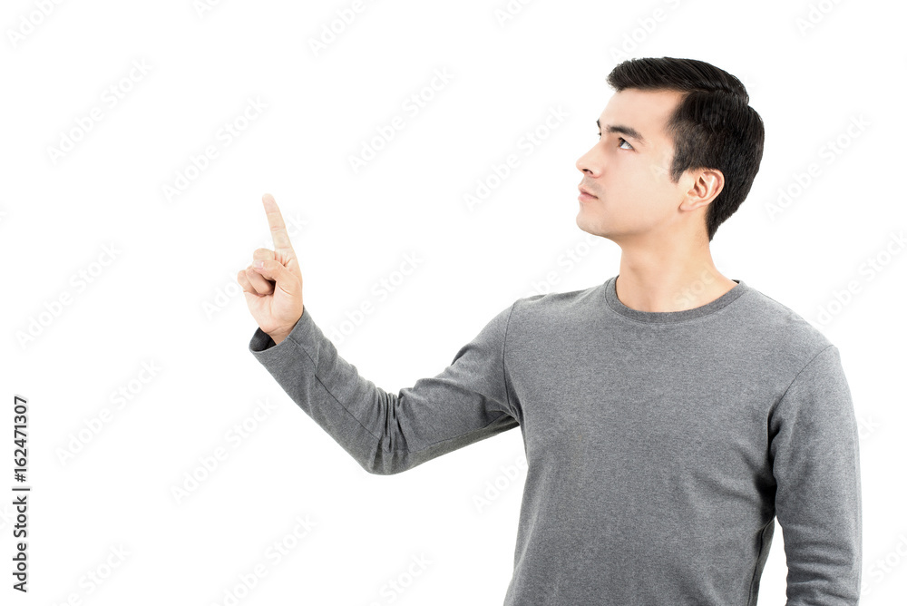 Young Hispanic man pointing his finger up on empty space Young Hispanic man pointing his finger up on empty space