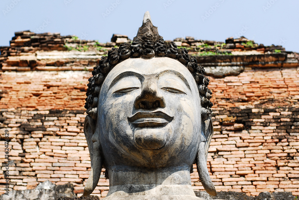 Close-up picture of a Buddha Face in Sukhothai, Thailand.