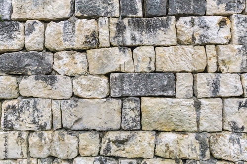 Old grungy gray stone wall texture