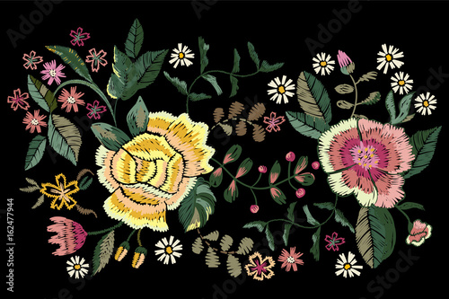 Embroidery folk pattern with roses and chamomiles. Vector embroidered floral flowers for clothing design.