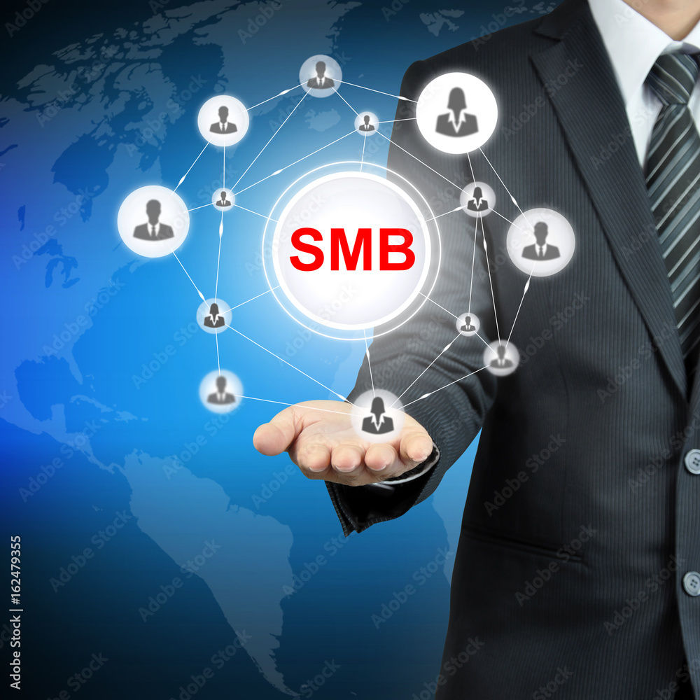 SMB (or Small and Medium-sized Businesses) sign on businessman hand SMB (or Small and Medium-sized Businesses) sign on businessman hand
