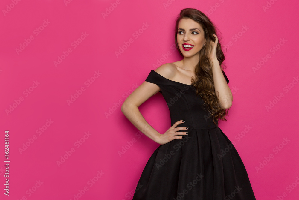 Cheerful Elegant Woman In Black Dress Is Looking Away Cheerful Elegant Woman In Black Dress Is Looking Away