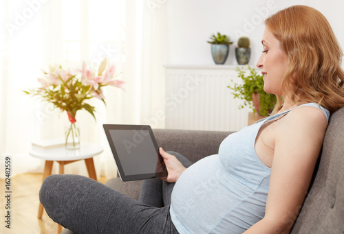 Pregnant woman with digital tablet © goir