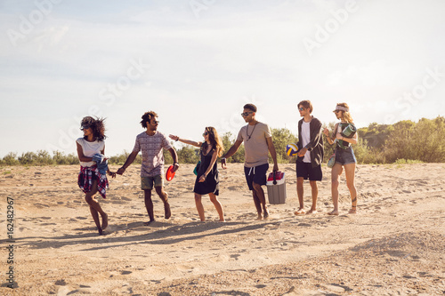 Diverse group of young friends having a walk