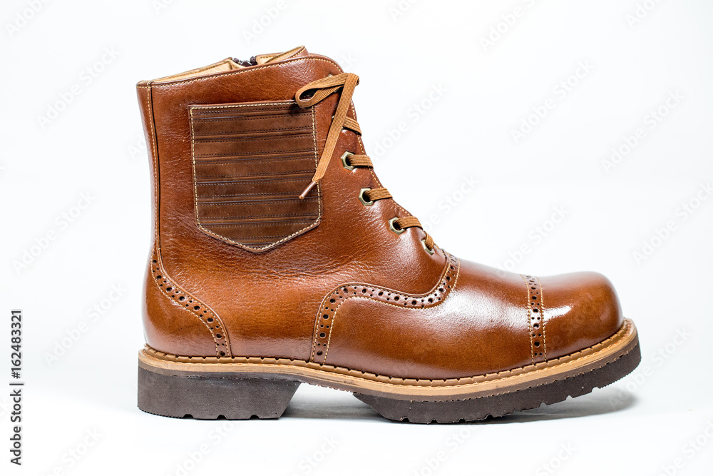 Beautifully lit with natural light a pair of polished man's shoes against a white background. Close-up. Beautifully lit with natural light a pair of polished man's shoes against a white background. Close-up.