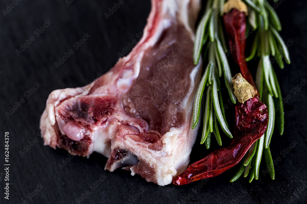 Raw lamb ribs on black background Raw lamb ribs on black background