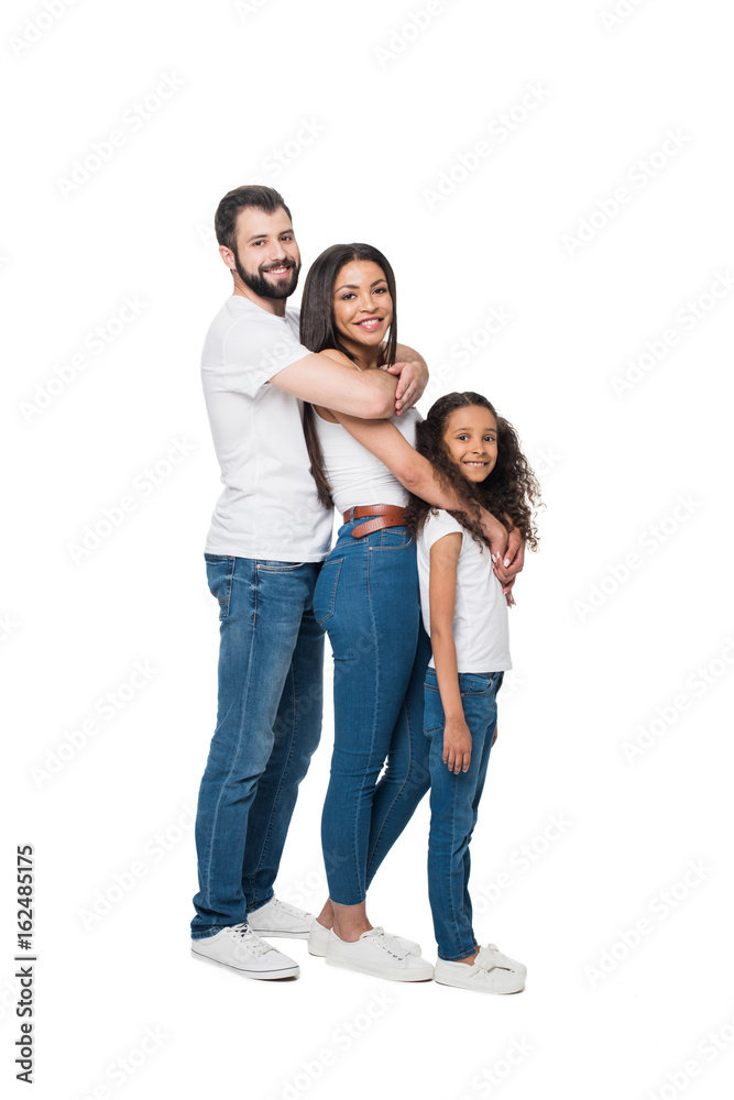 side view of cheerful multiethnic family hugging and standing in line together isolated on white side view of cheerful multiethnic family hugging and standing in line together isolated on white