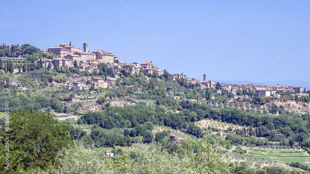 Stunning aerial view of the Tuscan hilltop village of Montepulciano, Siena, Italy, on a sunny day