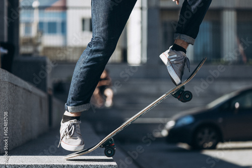 Foot and the skateboard in the air