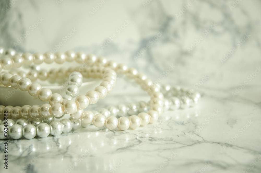 natural pearls on marble table