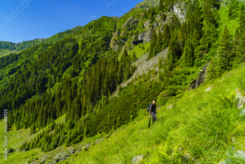 Young boy explores nature on the mountain