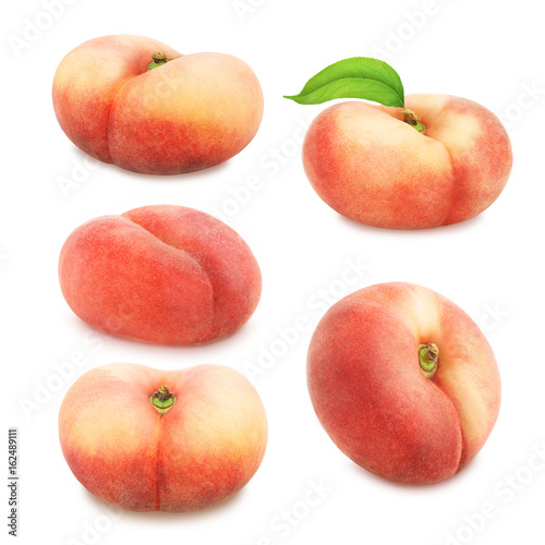 Set of flat peaches isolated on white.