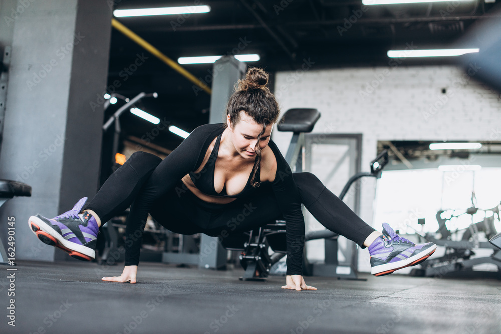 Flexible young woman train in the gym Flexible young woman train in the gym