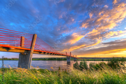 Cable stayed bridge over Vistula river in Poland at sunset