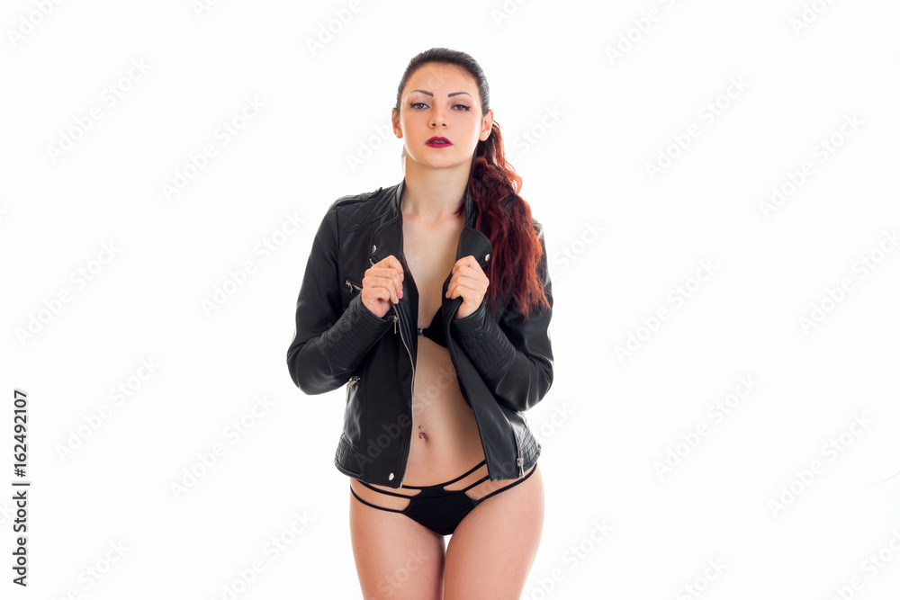 young erotic woman in black jacket and g-string posing on camera Stock  Photo | Adobe Stock
