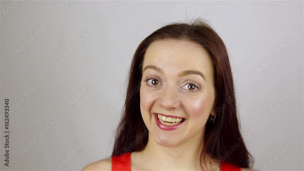 Portrait of a young beautiful woman. Smiling looking at camera.closeup Portrait of a young beautiful woman. Smiling looking at camera.closeup