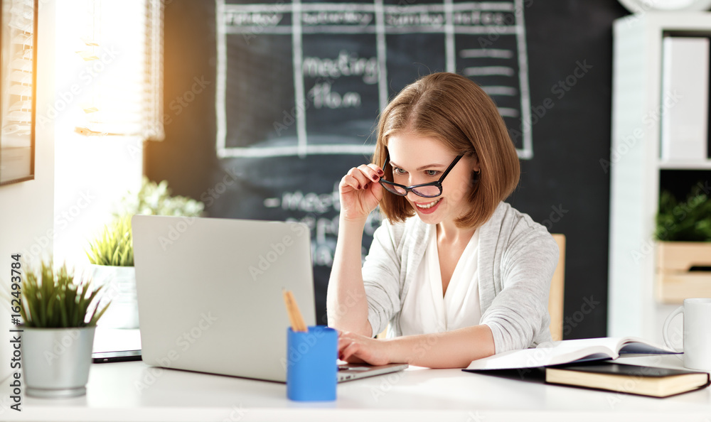Happy businesswoman woman student with computer and mobile phone Happy businesswoman woman student with computer and mobile phone