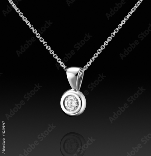 White gold pendant with huge diamond on black background