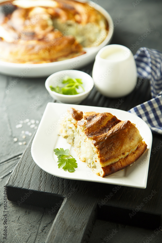 Pie with potato and herbs or Burek pie