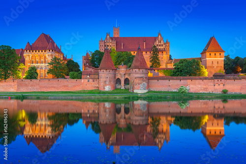The Castle of the Teutonic Order in Malbork at dusk, Poland