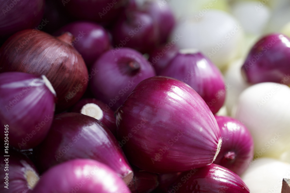 Red onions on the market, Colorful photo of red onions with defocused background, Selective focus with shallow depth of field