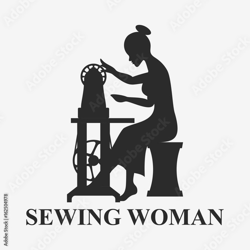 Woman sitting with sewing machine