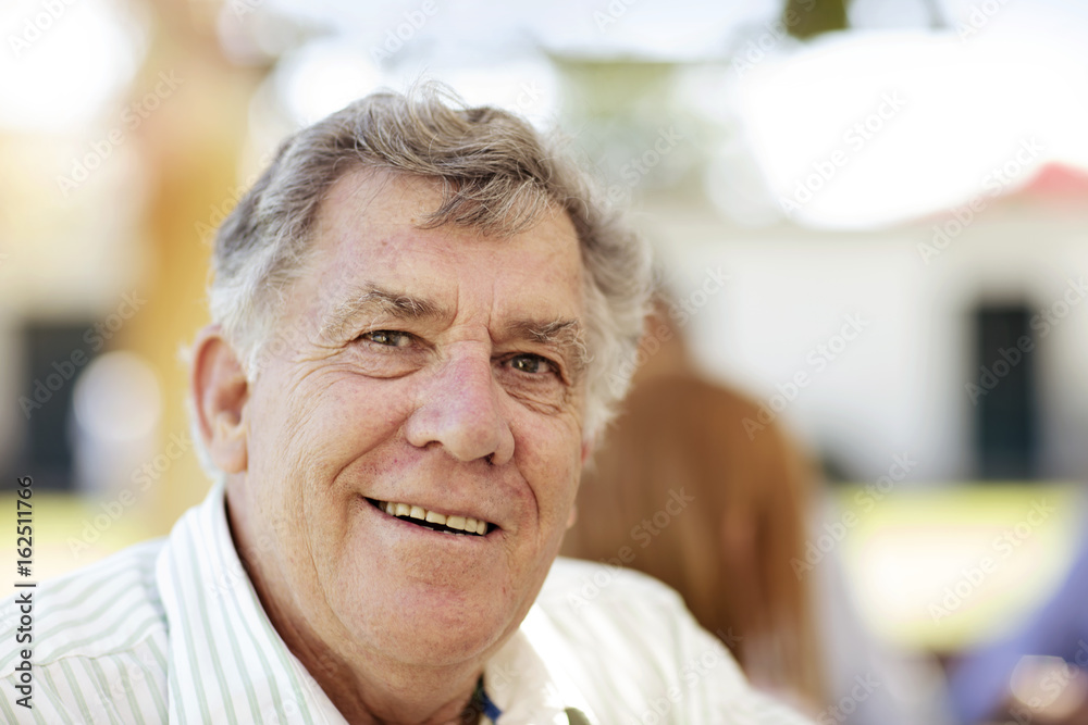 Portrait of smiling senior man outdoors Portrait of smiling senior man outdoors