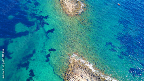 Aerial drone photo of Hamolia area with turquoise colored clear water rocky beaches, Porto Rafti, Mesogeia, Attica, Greece