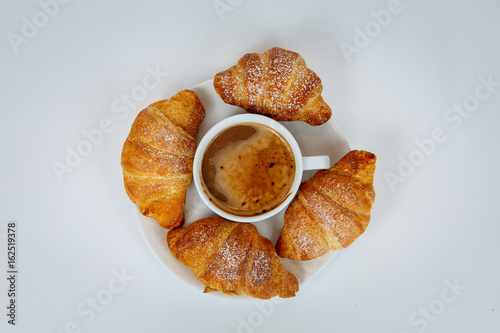 Lush croissants with fragrant coffee for breakfast