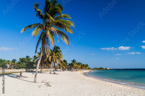 PLAYA GIRON  CUBA - FEB 14  2016  Tourists at the beach Playa Giron  Cuba. This beach is famous for its role during the Bay of Pigs invasion.