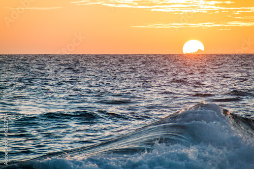 Fototapeta Naklejka Na Ścianę i Meble -  Sunset over the rough sea